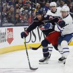 
              Columbus Blue Jackets' Boone Jenner, left, Toronto Maple Leafs' Ilya Lyubushkin, center, and Maple Leafs' Travis Dermott chase the puck during the second period of an NHL hockey game Monday, March 7, 2022, in Columbus, Ohio. (AP Photo/Jay LaPrete)
            