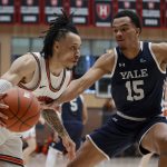 
              Princeton guard Jaelin Llewellyn drives against Yale forward EJ Jarvis (15) during the first half of an NCAA Ivy League men's college basketball championship game, Sunday, March 13, 2022, in Cambridge, Mass. (AP Photo/Mary Schwalm)
            