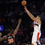 
              Washington Wizards' Kyle Kuzma (33) shoots over New York Knicks' Julius Randle (30) during the fourth quarter of an NBA basketball game Friday, March 18, 2022, in New York. (AP Photo/Jason DeCrow)
            