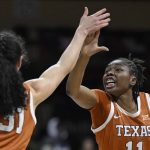 
              Texas guard Joanne Allen-Taylor (11) and teammate Texas guard Audrey Warren (31) celebrate a play against Baylor during the first half of an NCAA college basketball championship game in the Big 12 Conference tournament in Kansas City, Mo., Sunday, March 13, 2022. (AP Photo/Reed Hoffmann)
            