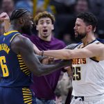 
              Denver Nuggets guard Austin Rivers (25) shoves Indiana Pacers guard Lance Stephenson (6) after a foul during the second half of an NBA basketball game in Indianapolis, Wednesday, March 30, 2022. A double technical was called on the play. The Nuggets won 125-118. (AP Photo/Michael Conroy)
            