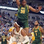 
              Baylor forward Flo Thamba (0) looks to shoot against Norfolk State defender Kris Bankston (30) during the second half of a college basketball game in the first round of the NCAA tournament in Fort Worth, Texas, Thursday, March 17, 2022. (AP Photo/LM Otero)
            