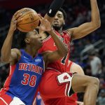
              Detroit Pistons guard Saben Lee (38) drives to the basket as Chicago Bulls forward Troy Brown Jr. (7) defends during the first half of an NBA basketball game, Wednesday, March 9, 2022, in Detroit. (AP Photo/Carlos Osorio)
            