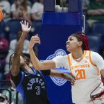 
              Kentucky's Jazmine Massengill (3) and Tennessee's Tamari Key (20) battle for the ball in the first half of an NCAA college basketball semifinal round game at the women's Southeastern Conference tournament Saturday, March 5, 2022, in Nashville, Tenn. (AP Photo/Mark Humphrey)
            