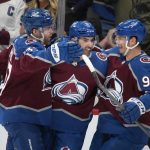 
              Colorado Avalanche center Nazem Kadri, center, is congratulated after scoring a goal by left wings J.T. Compher, left, and Andre Burakovsky in the first period of an NHL hockey game against the Philadelphia Flyers, Friday, March 25, 2022, in Denver. (AP Photo/David Zalubowski)
            