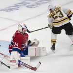 
              Boston Bruins' Brad Marchand scores the winning goal during the overtime period of an NHL hockey game against the Montreal Canadiens in Montreal, Monday, March 21, 2022. (Ryan Remiorz/The Canadian Press via AP)
            