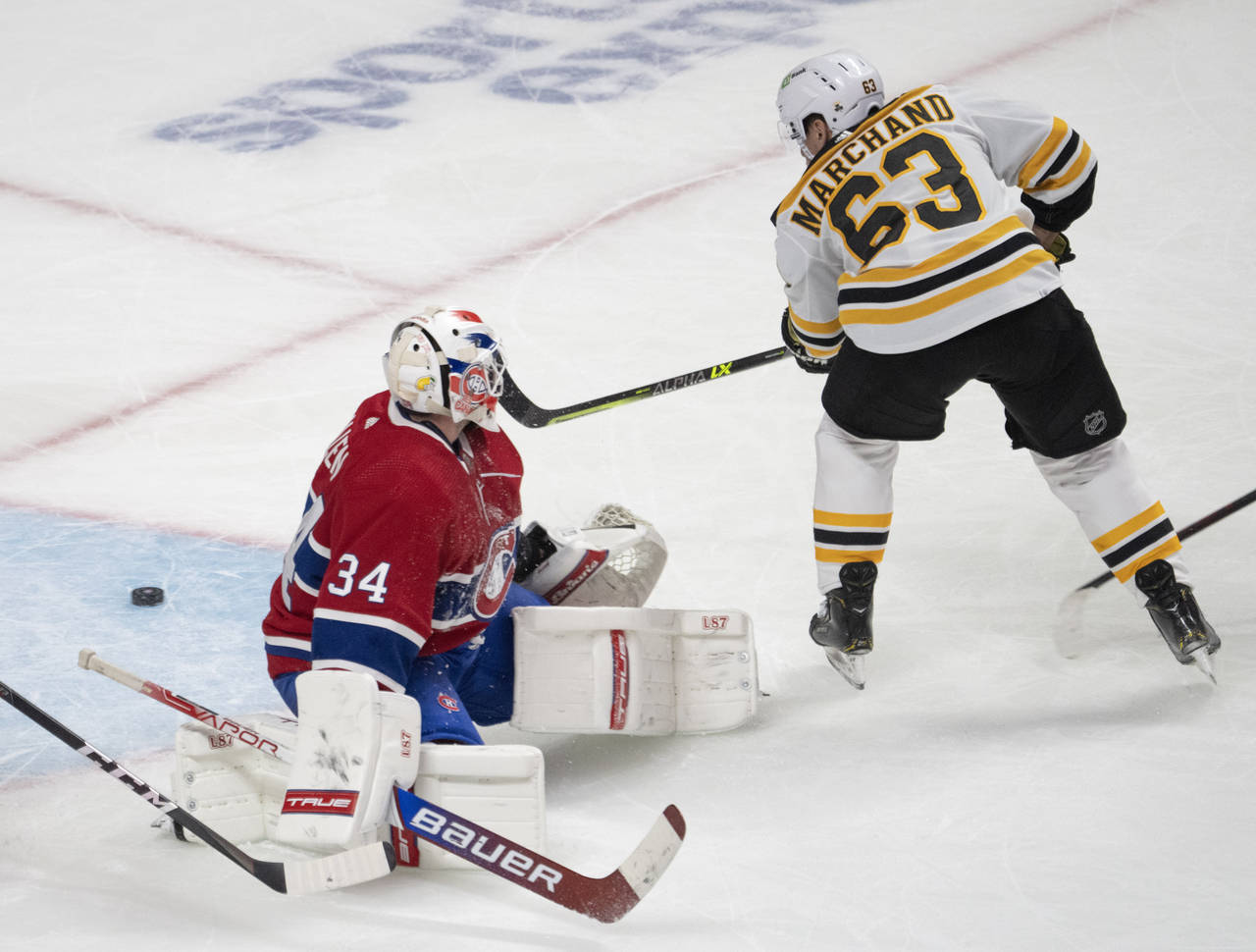 Boston Bruins' Brad Marchand scores the winning goal during the overtime period of an NHL hockey ga...