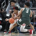 
              Wisconsin's Chucky Hepburn (23) is defended by Michigan State's Jaden Akins (3) during the second half of an NCAA college basketball game at the Big Ten Conference tournament, Friday, March 11, 2022, in Indianapolis. (AP Photo/Darron Cummings)
            