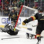 
              Florida Panthers center Carter Verhaeghe (23) slides into the net in a scoring attempt on Vegas Golden Knights goaltender Logan Thompson, lower left, during the first period of an NHL hockey game Thursday, March 17, 2022, in Las Vegas. (AP Photo/Steve Marcus)
            