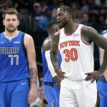 
              New York Knicks forward Julius Randle (30) talks to Dallas Mavericks guard Luka Doncic (77) during the second half of an NBA basketball game in Dallas, Wednesday, March 9, 2022. The Knicks won 107-77. (AP Photo/LM Otero)
            