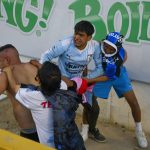 
              Fans clash during a Mexican soccer league match between the host Queretaro and Atlas from Guadalajara, at the Corregidora stadium, in Queretaro, Mexico, Saturday, March 5, 2022. Multiple people were injured during the brawl, including two critically.  (AP Photo/Sergio Gonzalez)
            