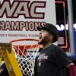
              New Mexico State guard Teddy Allen celebrates after the team's victory over Abilene Christian in an NCAA college basketball game for the championship of Western Athletic Conference men's tournament Saturday, March 12, 2022, in Las Vegas. (AP Photo/Rick Bowmer)
            