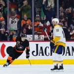 
              Philadelphia Flyers' Joel Farabee, left, reacts past Nashville Predators' Colton Sissons after scoring a goal during the third period of an NHL hockey game, Thursday, March 17, 2022, in Philadelphia. (AP Photo/Matt Slocum)
            