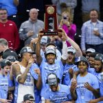 
              North Carolina players celebrate after North Carolina won a college basketball game against St. Peter's in the Elite 8 round of the NCAA tournament, Sunday, March 27, 2022, in Philadelphia. (AP Photo/Matt Rourke)
            