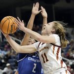 
              Iowa State guard Emily Ryan (11) shoots while Creighton guard Tatum Rembao (2) defends during the first half of a college basketball game in the Sweet 16 round of the NCAA women's tournament in Greensboro, N.C., Friday, March 25, 2022. (AP Photo/Gerry Broome)
            