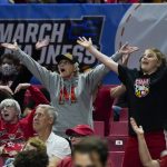 
              Spectators react during the second half of a college basketball game between Maryland and Delaware in the first round of the NCAA women's tournament, Friday, March 18, 2022, in College Park, Md. Maryland won 102-71. Eight double-digit seeds already have won in this tournament, tying 2018 for the most ever in NCAA women’s basketball history through two rounds. (AP Photo/Julio Cortez)
            