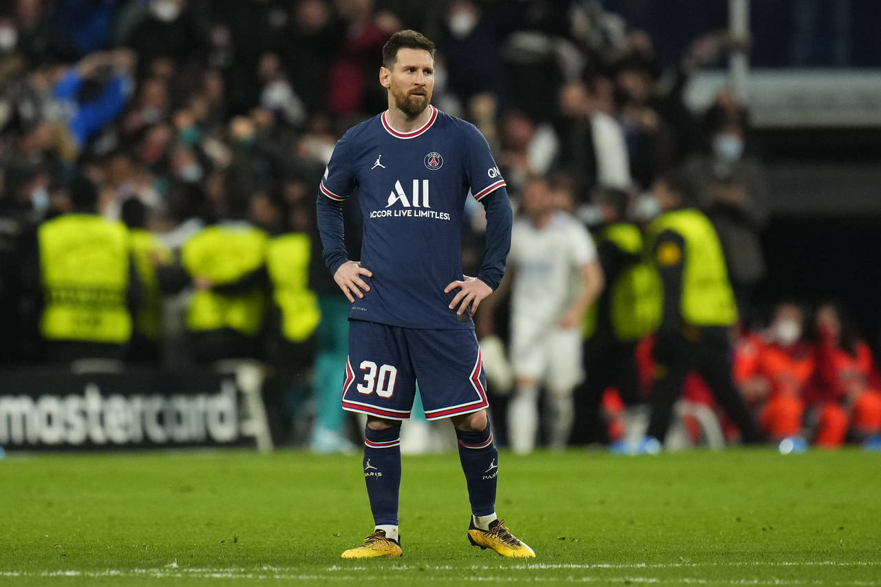 PSG's Lionel Messi reacts after Real Madrid scored their side's third goal during the Champions Lea...