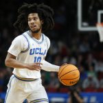 
              UCLA guard Tyger Campbell (10) looks to pass against Akron during the first half of a first-round NCAA college basketball tournament game, Thursday, March 17, 2022, in Portland, Ore. (AP Photo/Craig Mitchelldyer)
            