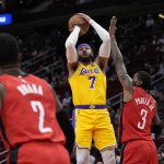 
              Los Angeles Lakers' Carmelo Anthony (7) shoots as Houston Rockets' Kevin Porter Jr. (3) defends during the first half of an NBA basketball game Wednesday, March 9, 2022, in Houston. (AP Photo/David J. Phillip)
            