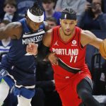 
              Portland Trail Blazers guard Josh Hart (11) struggles to bring the ball around Minnesota Timberwolves guard Patrick Beverley in the first quarter of an NBA basketball game Monday, March 7, 2022, in Minneapolis. (AP Photo/Bruce Kluckhohn)
            