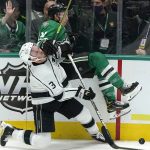 
              Dallas Stars left wing Jason Robertson (21) and Los Angeles Kings defenseman Matt Roy (3) hit the boards during the third period of an NHL hockey game in Dallas, Wednesday, March 2, 2022. The Stars won 4-3. (AP Photo/LM Otero)
            