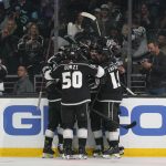 
              The Los Angeles Kings celebrate after rLos Angeles Kings center Anze Kopitar (11) scored during the second period of an NHL hockey game against the Seattle Kraken Saturday, March 26, 2022, in Los Angeles. (AP Photo/Ashley Landis)
            