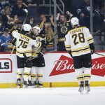 
              Boston Bruins' Brad Marchand (63), Jake DeBrusk (74), Connor Clifton (75), and Derek Forbort (28) celebrate Marchand's goal against the Winnipeg Jets during the second period of an NHL hockey game Friday, March 18, 2022 in Winnipeg, Manitoba.(John Woods/The Canadian Press via AP)
            