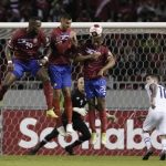 
              Costa Rica's Brandon Aguilera, left, Kendall Waston, second left, Juan Pablo Vargas, third left, and Ian Lawrence, center right, go for a header during a qualifying soccer match against United States for the FIFA World Cup Qatar 2022 in San Jose, Costa Rica, Wednesday, March 30, 2022. (AP Photo/Moises Castillo)
            