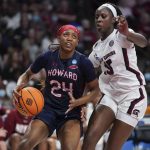 
              Howard forward Brooklynn Fort-Davis (24) dribbles the ball against South Carolina forward Laeticia Amihere (15) during the first half of a first round game in the NCAA women's college basketball tournament Friday, March 18, 2022 in Columbia, S.C. (AP Photo/Sean Rayford)
            
