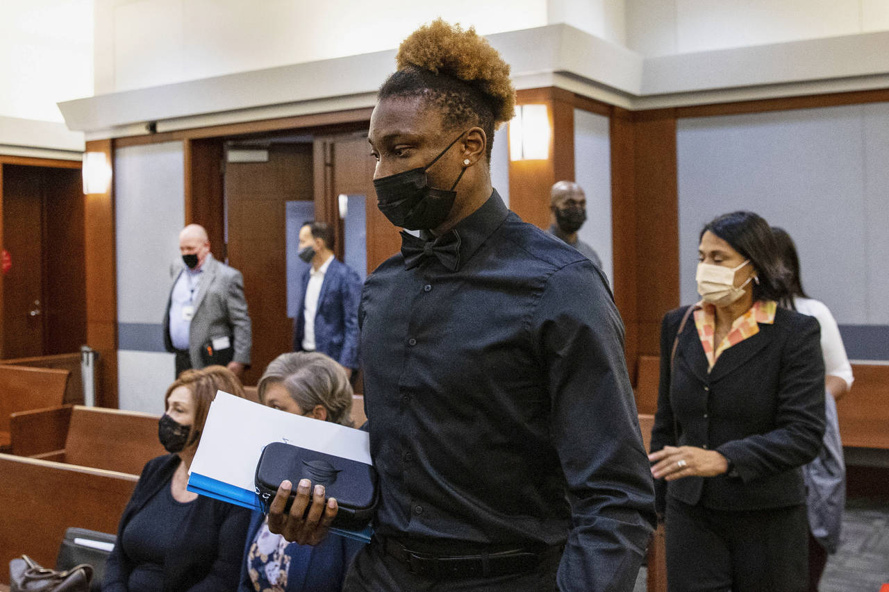 FILE - Former Las Vegas Raiders wide receiver Henry Ruggs arrives in court during his hearing at th...