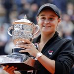 
              FILE - In this June 8, 2019, file photo, Australia's Ashleigh Barty holds the trophy as she celebrates after defeating Marketa Vondrousova, of the Czech Republic, in the women's final of the French Open tennis tournament at the Roland Garros stadium in Paris. In a shock announcement Wednesday, March 23, 2022, No. 1-ranked Barty announced her retirement from tennis. (AP Photo/Christophe Ena, File)
            