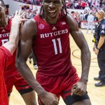 
              Rutgers center Clifford Omoruyi (11) celebrates as he leaves the court after the team defeated of Indiana in an NCAA college basketball game, Wednesday, March 2, 2022, in Bloomington, Ind. (AP Photo/Doug McSchooler)
            