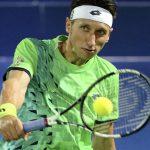 
              FILE -Sergiy Stakhovsky from Ukraine returns the ball to Stan Wawrinka from Switzerland during a second day match of the Dubai Tennis Championships in Dubai, United Arab Emirates, Tuesday, Feb. 23, 2016. About 1 1/2 months after the last match of Sergiy Stakhovsky’s professional tennis career, the 36-year-old Ukrainian left his wife and three young children in Hungary and went back to his birthplace to help however he could during Russia’s invasion. (AP Photo/Kamran Jebreili, File)
            