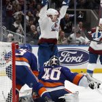 
              Colorado Avalanche right wing Mikko Rantanen, top, reacts to a goal scored against New York Islanders goaltender Semyon Varlamov (40) by teammate Nathan MacKinnon (not shown) early in the third period of an NHL hockey game on Monday, March 7, 2022, in Elmont, N.Y. (AP Photo/Jim McIsaac)
            