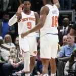 
              New York Knicks guard RJ Barrett (9) gets a high five from teammate Alec Burks (18) during the first half of an NBA basketball game in against the Dallas Maverick in Dallas, Wednesday, March 9, 2022. (AP Photo/LM Otero)
            