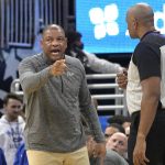 
              Philadelphia 76ers head coach Doc Rivers, left, with official Kevin Cutler (34) during the first half of an NBA basketball game against the Orlando Magic, Sunday, March 13, 2022, in Orlando, Fla. (AP Photo/Phelan M. Ebenhack)
            