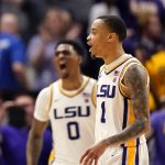
              LSU guard Xavier Pinson (1) and guard Brandon Murray (0) react after defeating Alabama in overtime of an NCAA college basketball game in Baton Rouge, La., Saturday, March 5, 2022. LSU won 80-77. (AP Photo/Gerald Herbert)
            
