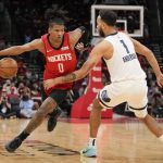 
              Houston Rockets guard Jalen Green (0) dribbles as Memphis Grizzlies forward Kyle Anderson defends during the first half of an NBA basketball game, Sunday, March 20, 2022, in Houston. (AP Photo/Eric Christian Smith)
            