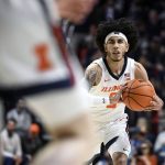 
              Illinois' Andre Curbelo passes the ball during the first half of an NCAA college basketball game against Penn State Thursday, March 3, 2022, in Champaign, Ill. (AP Photo/Michael Allio)
            