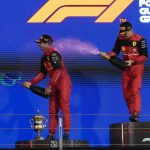 
              First placed Ferrari driver Charles Leclerc of Monaco, right, and second placed Ferrari driver Carlos Sainz of Spain celebrate on the podium after the Formula One Bahrain Grand Prix it in Sakhir, Bahrain, Sunday, March 20, 2022. (AP Photo/Hassan Ammar)
            