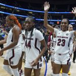 
              South Carolina players leave the court after beating Mississippi in an NCAA college basketball semifinal round game at the women's Southeastern Conference tournament Saturday, March 5, 2022, in Nashville, Tenn. (AP Photo/Mark Humphrey)
            