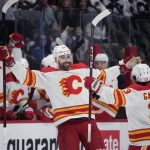
              Calgary Flames defenseman Erik Gudbranson, left, celebrates his goal with left wing Johnny Gaudreau during the second period of the team's NHL hockey game against the Colorado Avalanche on Saturday, March 5, 2022, in Denver. (AP Photo/David Zalubowski)
            