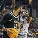 
              Texas A&M's Wade Taylor IV (4) defends against Wake Forest's Dallas Walton (13) during the first half of an NCAA college basketball game in the third round of the NIT in College Station, Texas, Wednesday, March 23, 2022. (Michael Miller/College Station Eagle via AP)
            