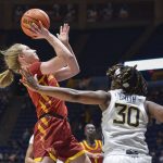 
              Iowa State guard Emily Ryan (11) shoots while being guarded by West Virginia guard Madisen Smith (30) during the second half of an NCAA college basketball game in Morgantown, W.Va., Saturday, March 5, 2021. (AP Photo/William Wotring)
            