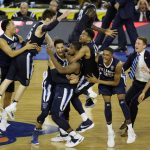 
              FILE - In this April 4, 2016, file photo, Villanova players celebrate in the closing seconds of the NCAA Final Four tournament college basketball championship game, in Houston. This year's Final Four is either unprecedented or pretty close. Villanova doesn't have quite the storied history of the other three schools, but the Wildcats are trying for their third national title in seven years on Saturday, April 2, 2022. (AP Photo/Charlie Neibergall, FIle)
            