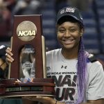 
              South Carolina forward Aliyah Boston (4) holds the trophy following a college basketball game against Creighton in the Elite 8 round of the NCAA tournament in Greensboro, N.C., Sunday, March 27, 2022. (AP Photo/Gerry Broome)
            