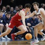 
              Indiana guard Trey Galloway, left, drives past St. Mary's guard Augustas Marciulionis (3) during the first half of a first-round NCAA college basketball tournament game, Thursday, March 17, 2022, in Portland, Ore. (AP Photo/Craig Mitchelldyer)
            