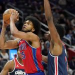 
              Detroit Pistons forward Marvin Bagley III (35) attempts a layup as Washington Wizards center Thomas Bryant defends during the first half of an NBA basketball game, Friday, March 25, 2022, in Detroit. (AP Photo/Carlos Osorio)
            