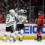 
              Dallas Stars right wing Alexander Radulov, center, celebrates his goal with Dallas Stars defenseman Esa Lindell (23) as Washington Capitals right wing Daniel Sprong (10) skates by during the first period of an NHL hockey game, Sunday, March 20, 2022, in Washington. (AP Photo/Nick Wass)
            