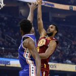 
              Cleveland Cavaliers' Evan Mobley (4) shoots against Philadelphia 76ers' Joel Embiid during the first half of an NBA basketball game Wednesday, March 16, 2022, in Cleveland. (AP Photo/Ron Schwane)
            